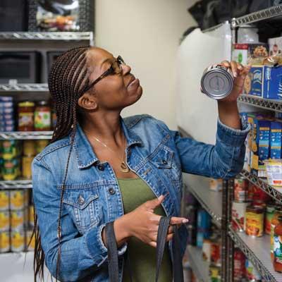 ksu student shopping for good at care services food pantry